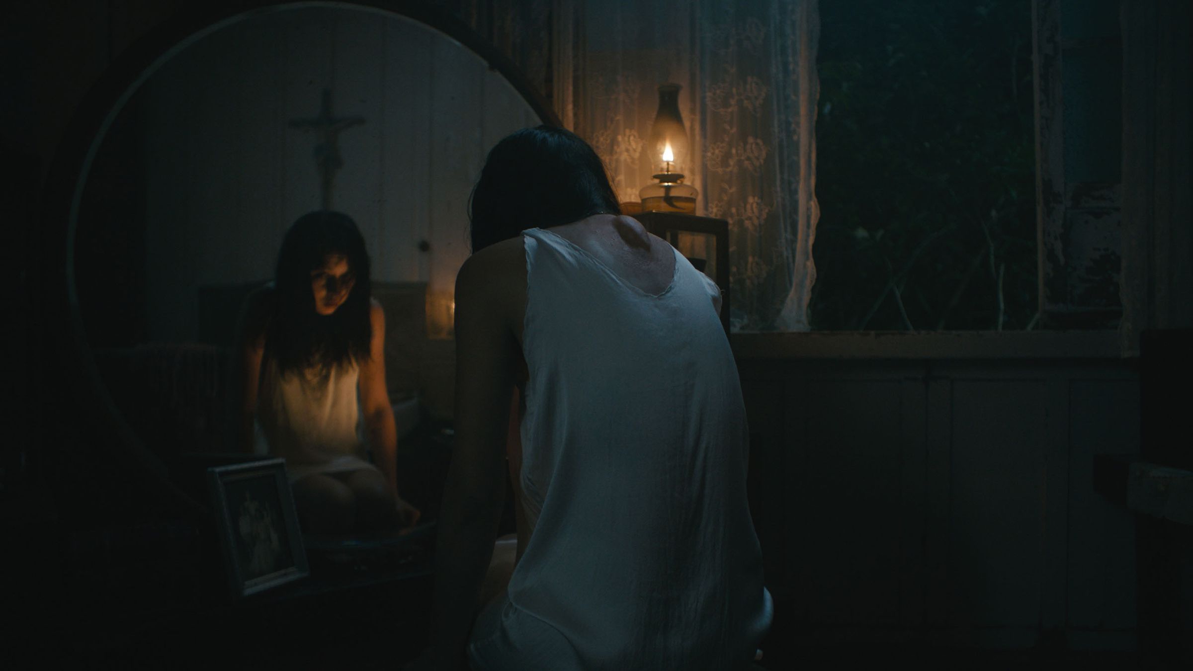 A photo of Beauty Gonzalez in the horror movie In My Mother's Skin.