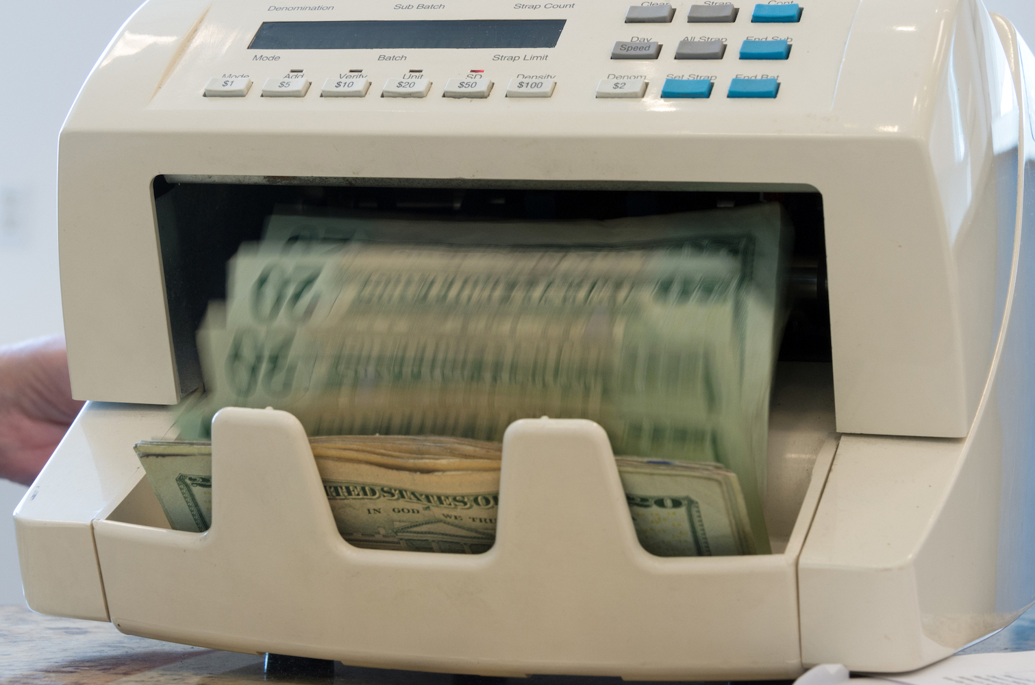 Machine that counts twenty dollar bills